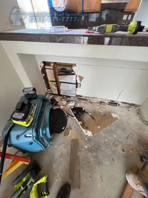 Air mover drying the opened floor beside the kitchen counter