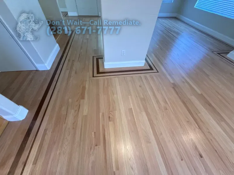 Finished hardwood floor with the inlay border laid again around a column