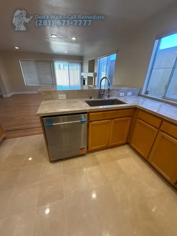 Finished kitchen with the new stone countertop, sink and dishwasher